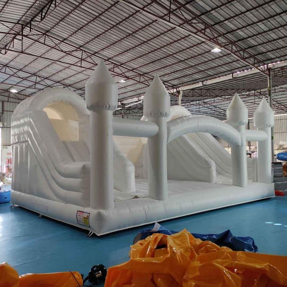 Large white bounce house with double slide