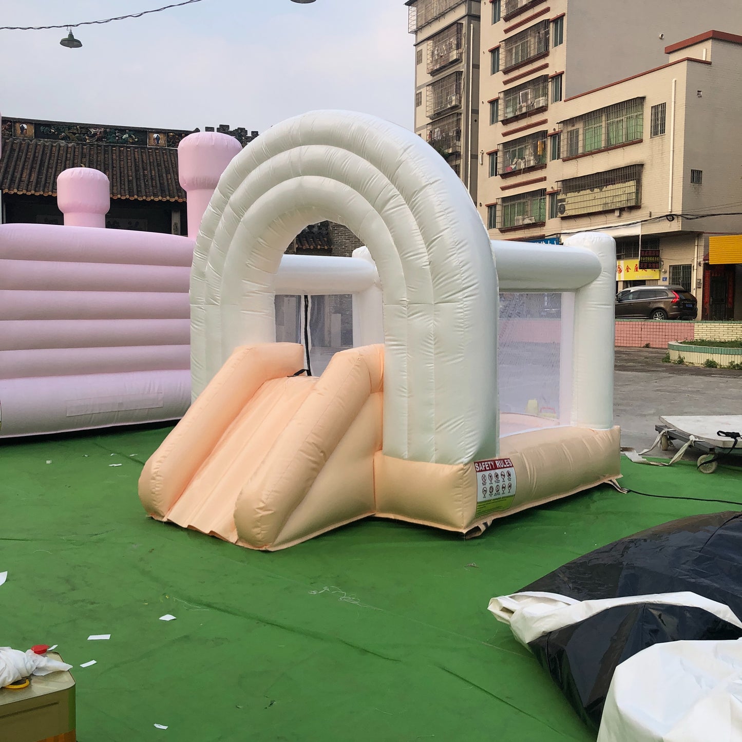 Peach And White Rainbow Bounce House