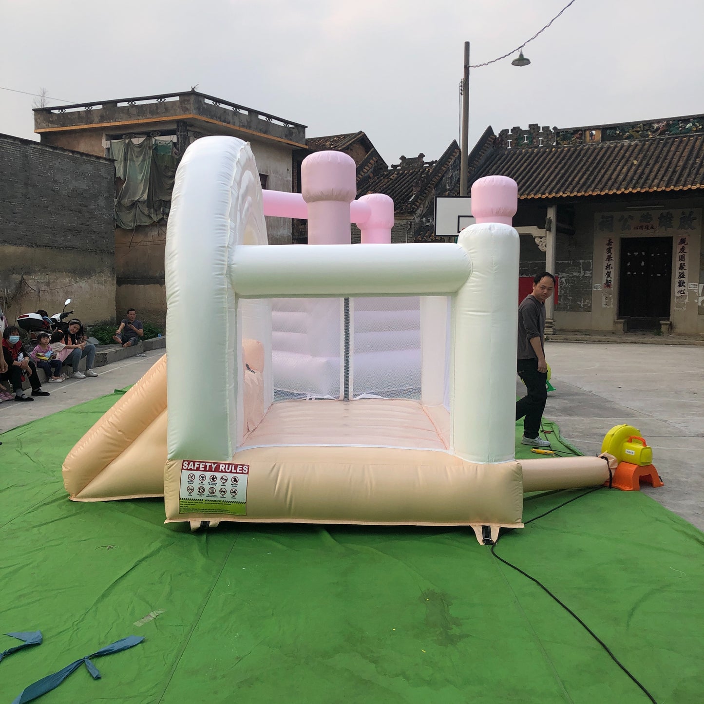 Peach And White Rainbow Bounce House