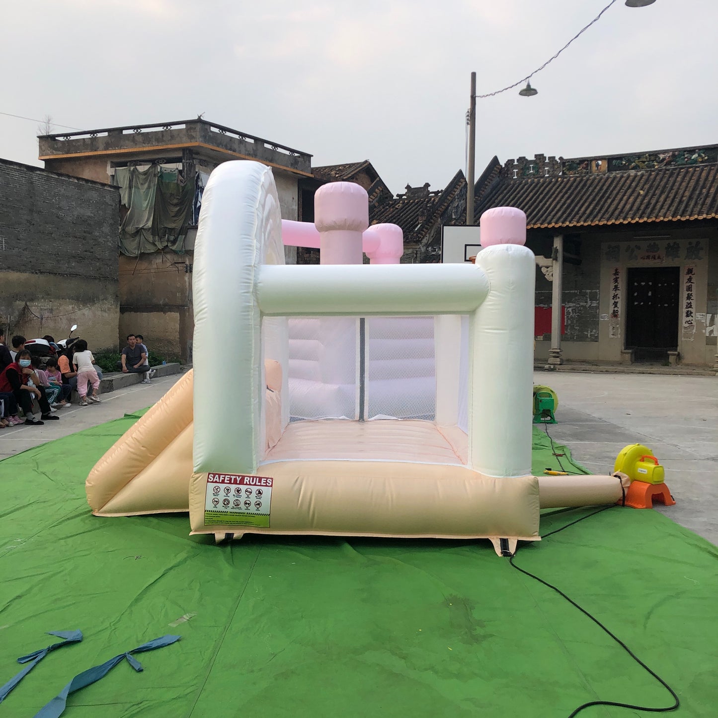 Peach And White Rainbow Bounce House