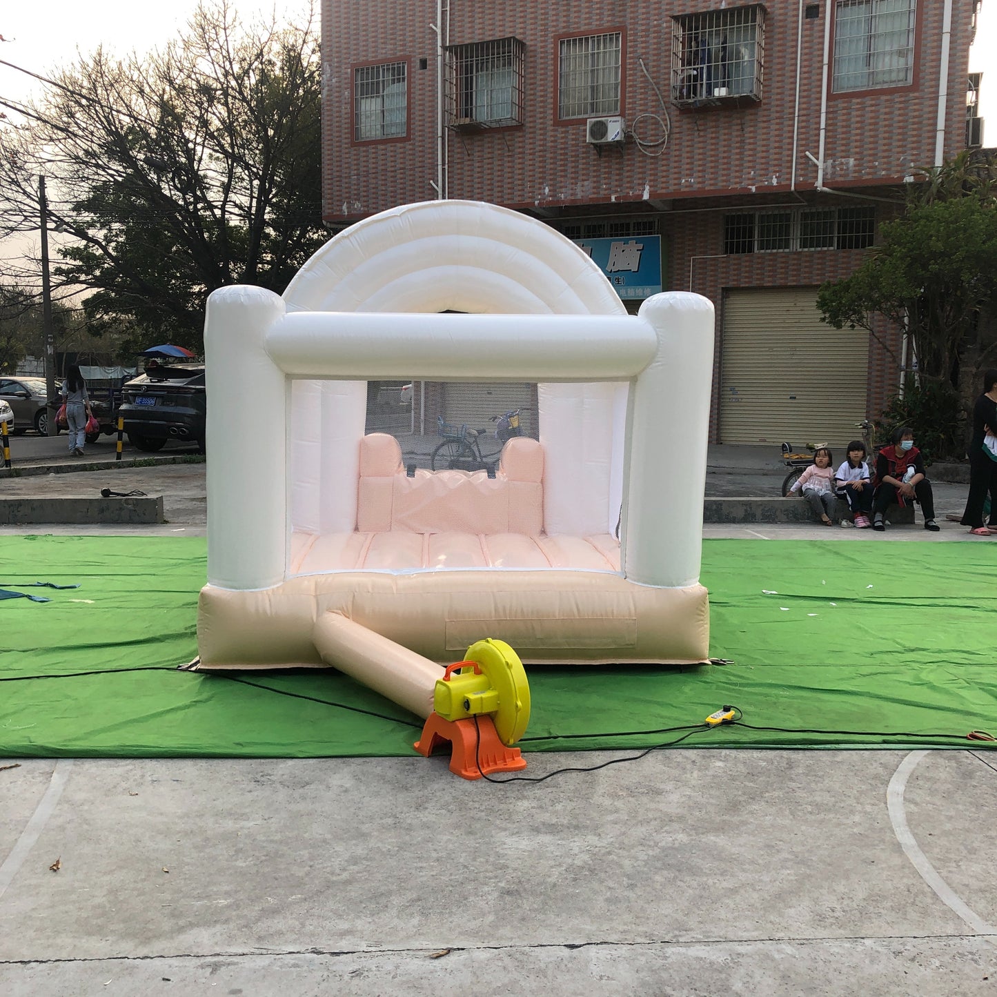 Peach And White Rainbow Bounce House