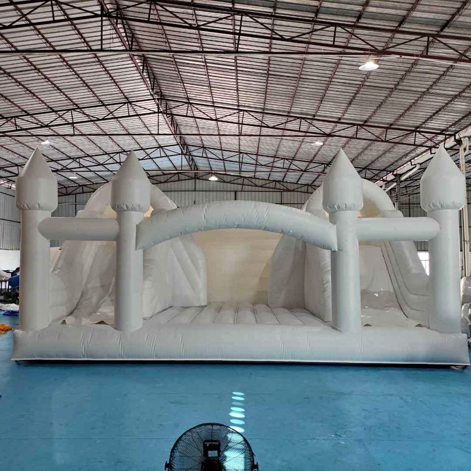 Large white bounce house with double slide